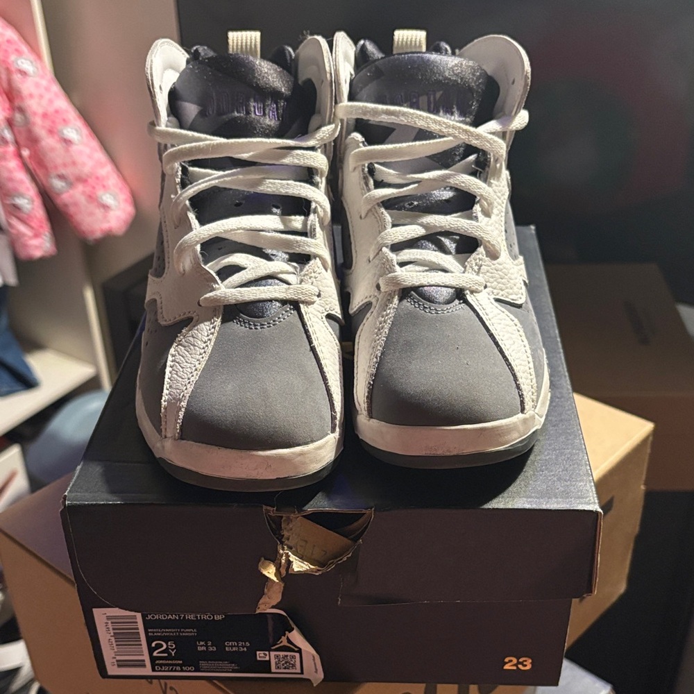 White and gray Jordan 7s flints